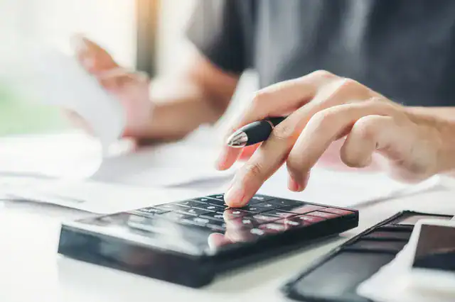 business-person-calculating-price