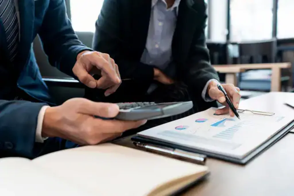 businessmen-calculating-costs